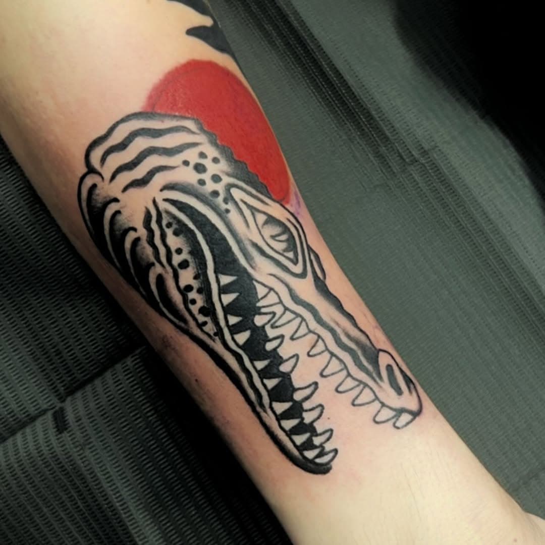 Alligator head with red sun