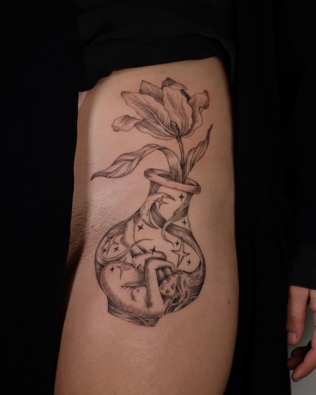 Floral vase with celestial figure