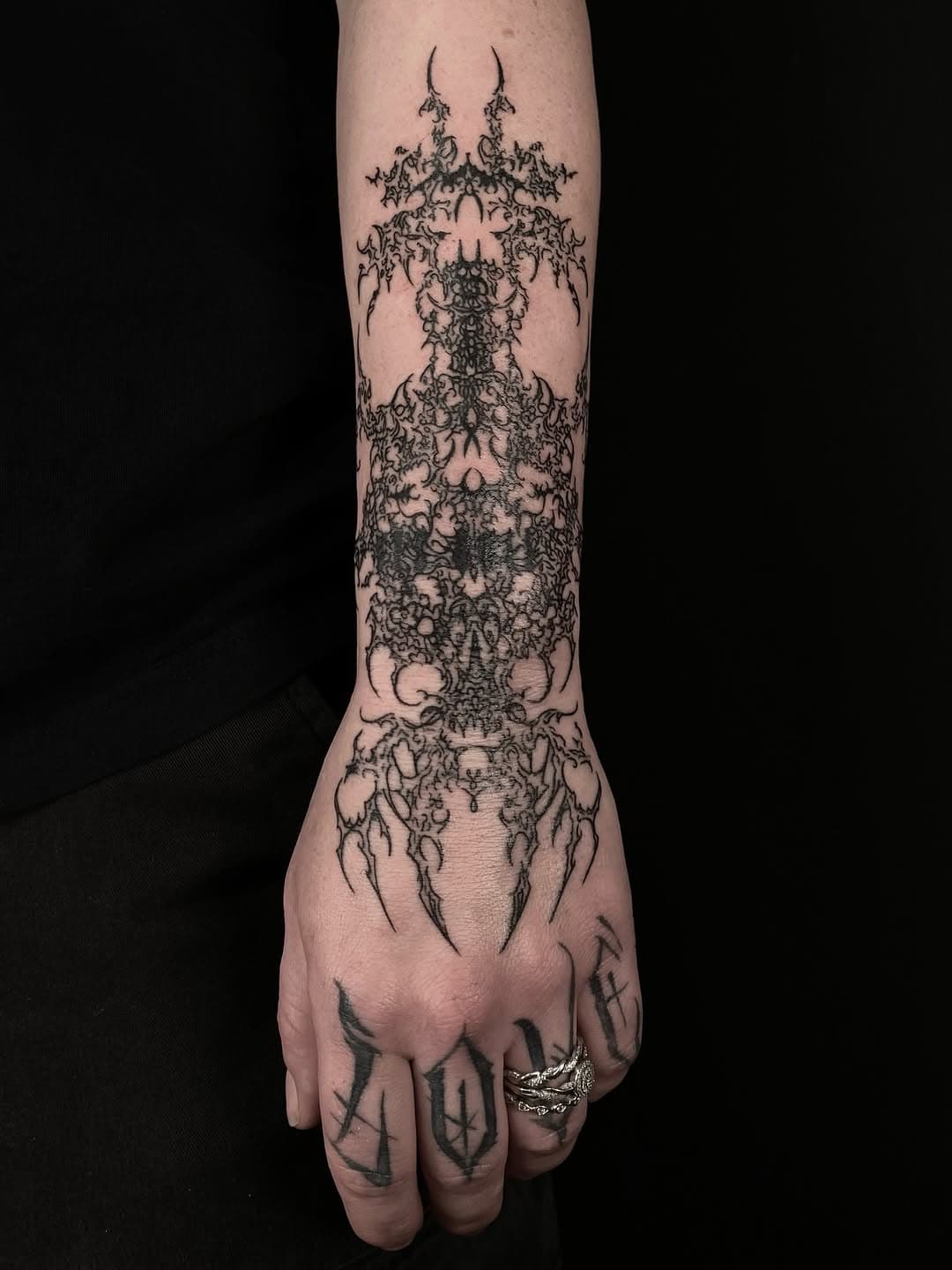 Symmetrical ornate forearm pattern