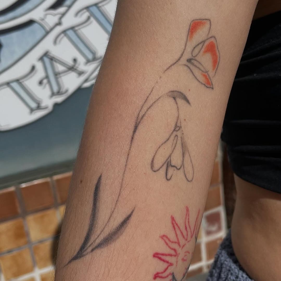 Botanical stalk with sun symbol