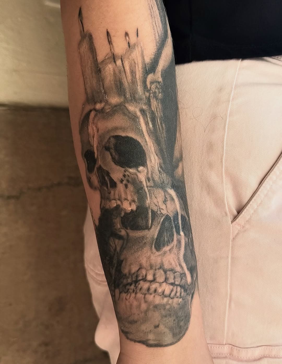 Stacked skulls with candles