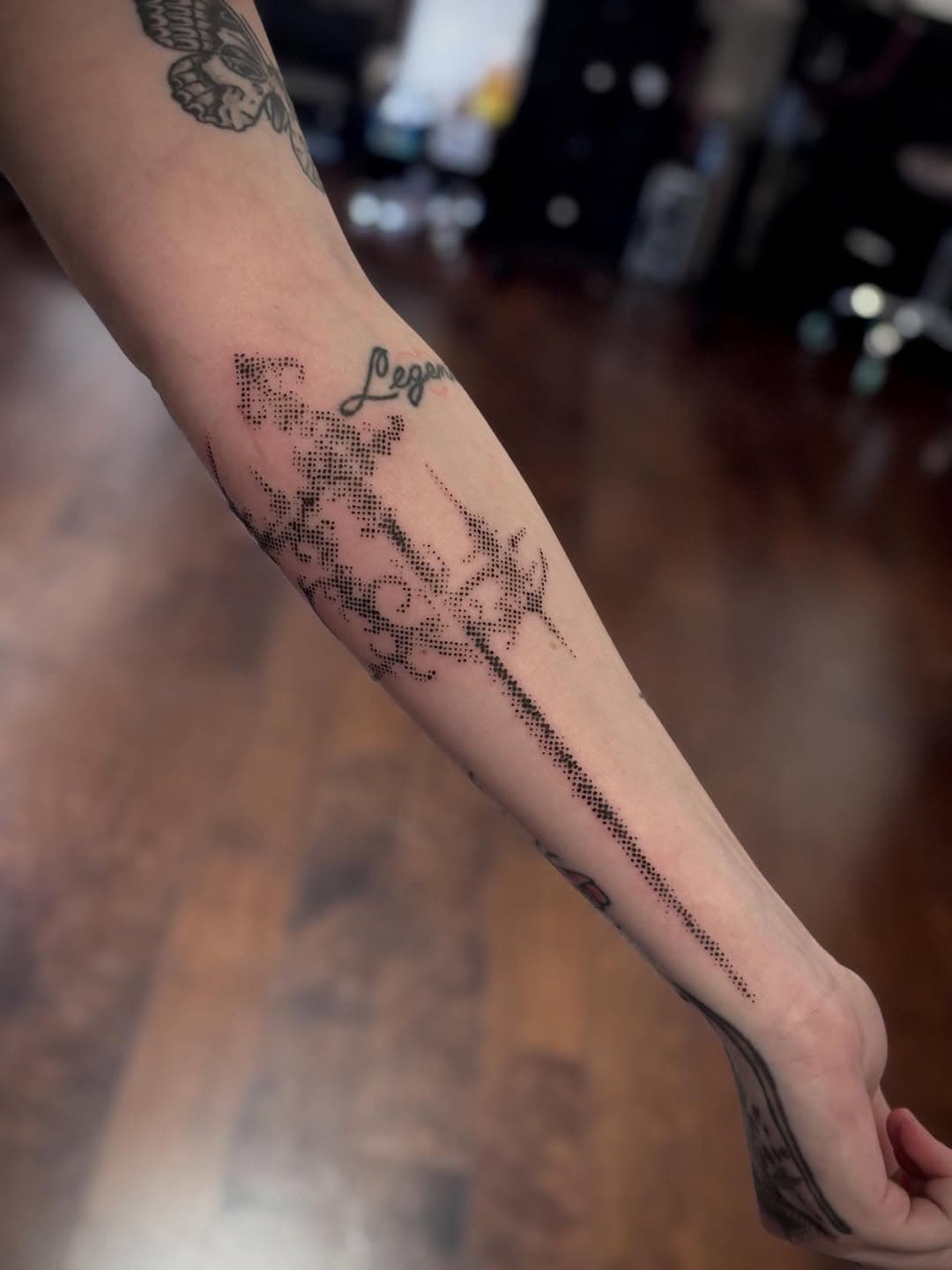 Pixelated Sword and Script on Arm