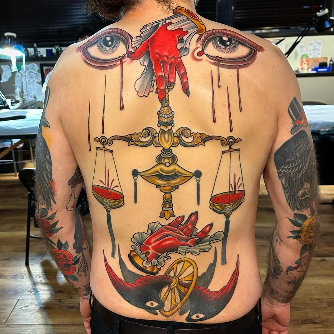 Dramatic back piece with symbolic elements