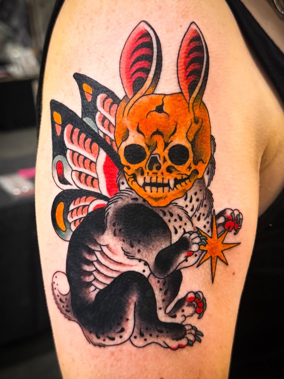 Rabbit-eared skull creature with wings