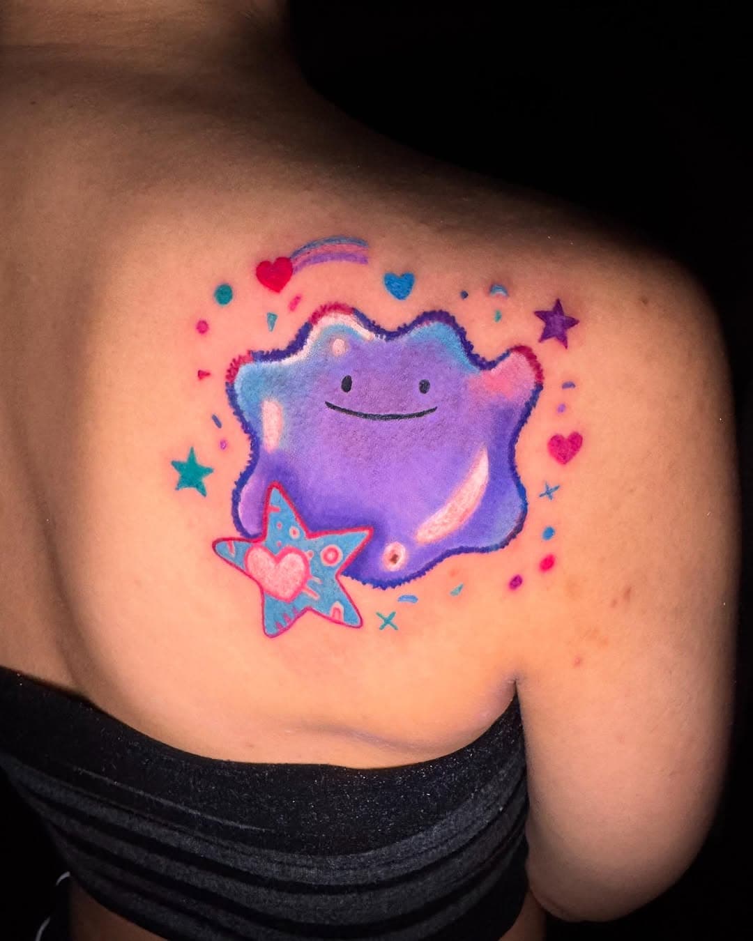 Purple blob character with stars and hearts