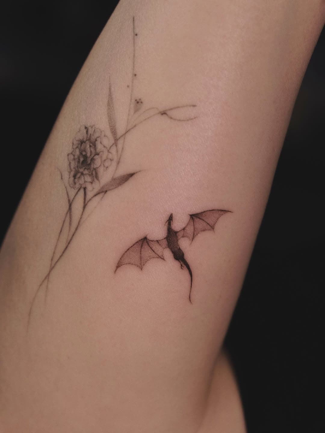 Dragon with blooming flower