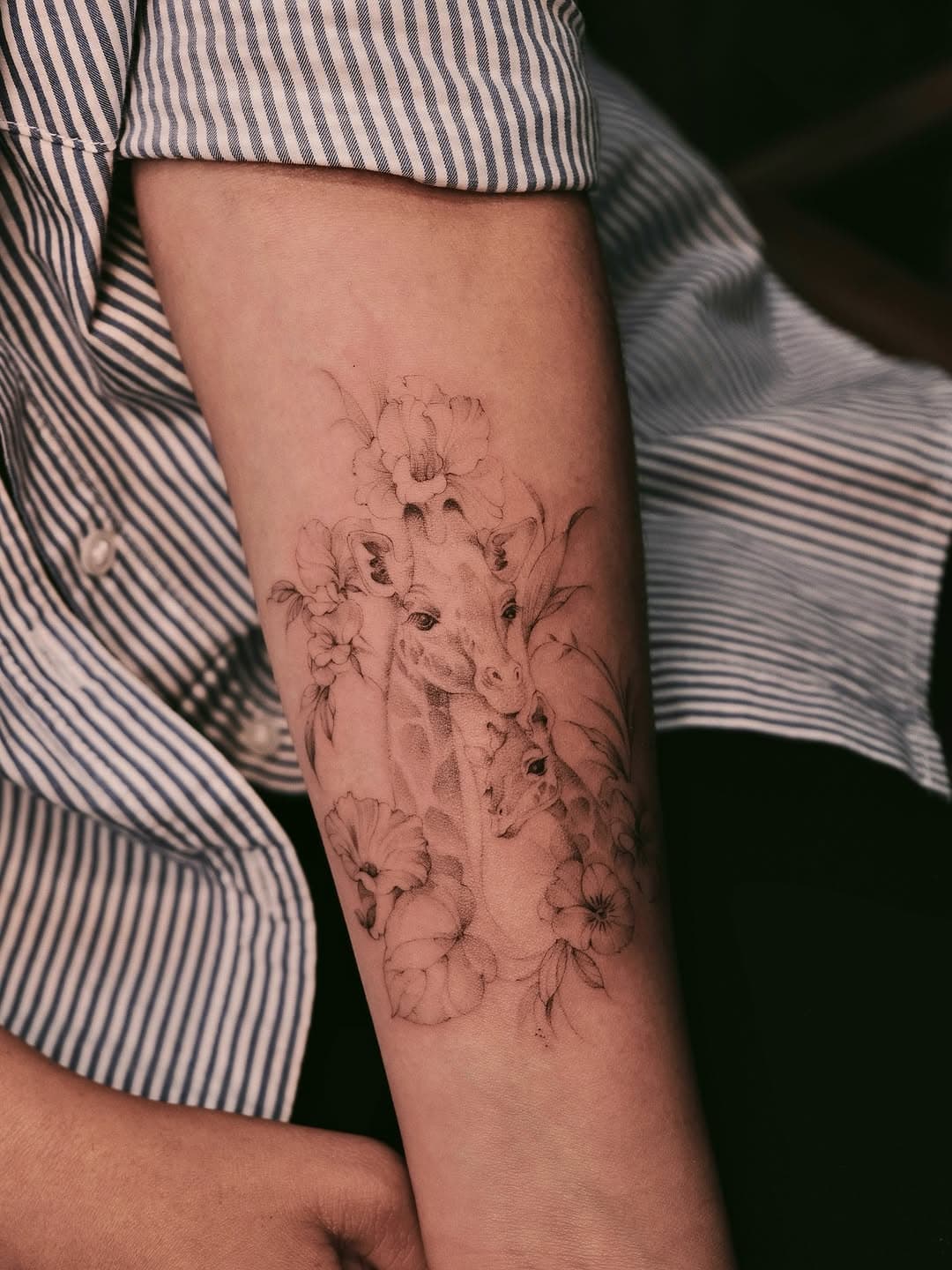 Giraffe family with blooming flora