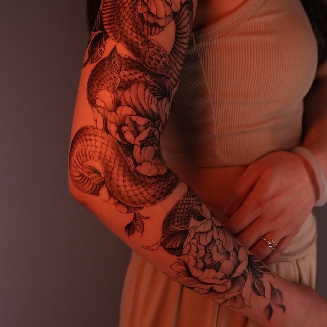 Serpent and floral arm art