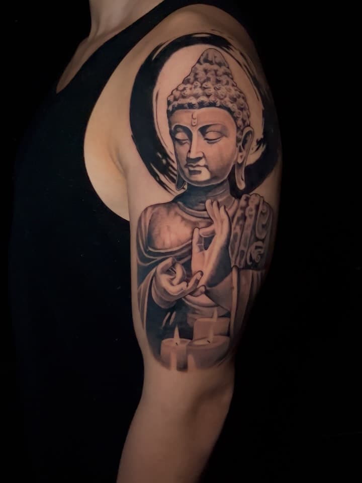 Serene Buddha with enso and candles