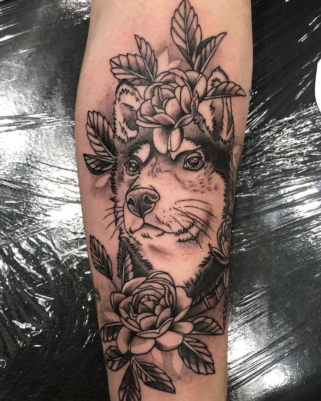 Canine head with floral wreath