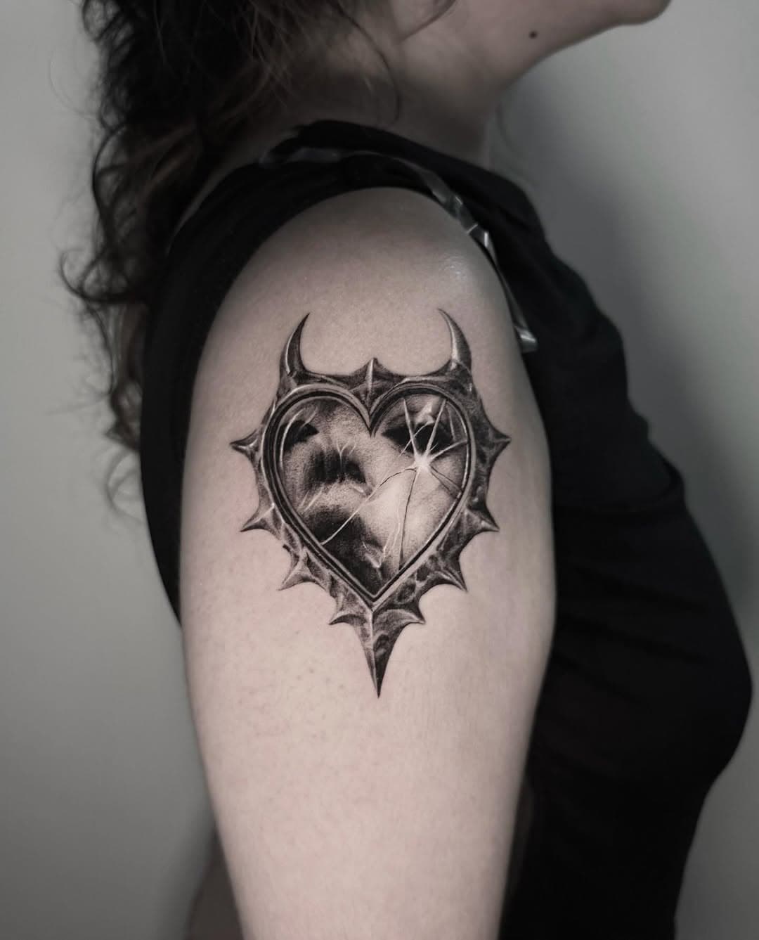 Shattered heart within a thorny frame