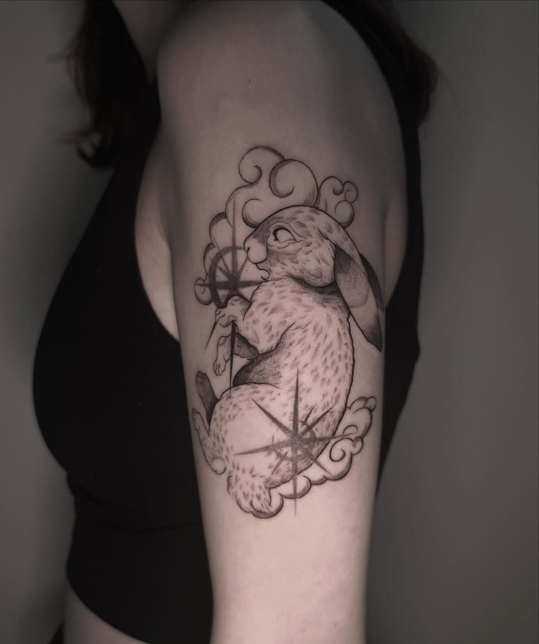 Celestial rabbit with a compass