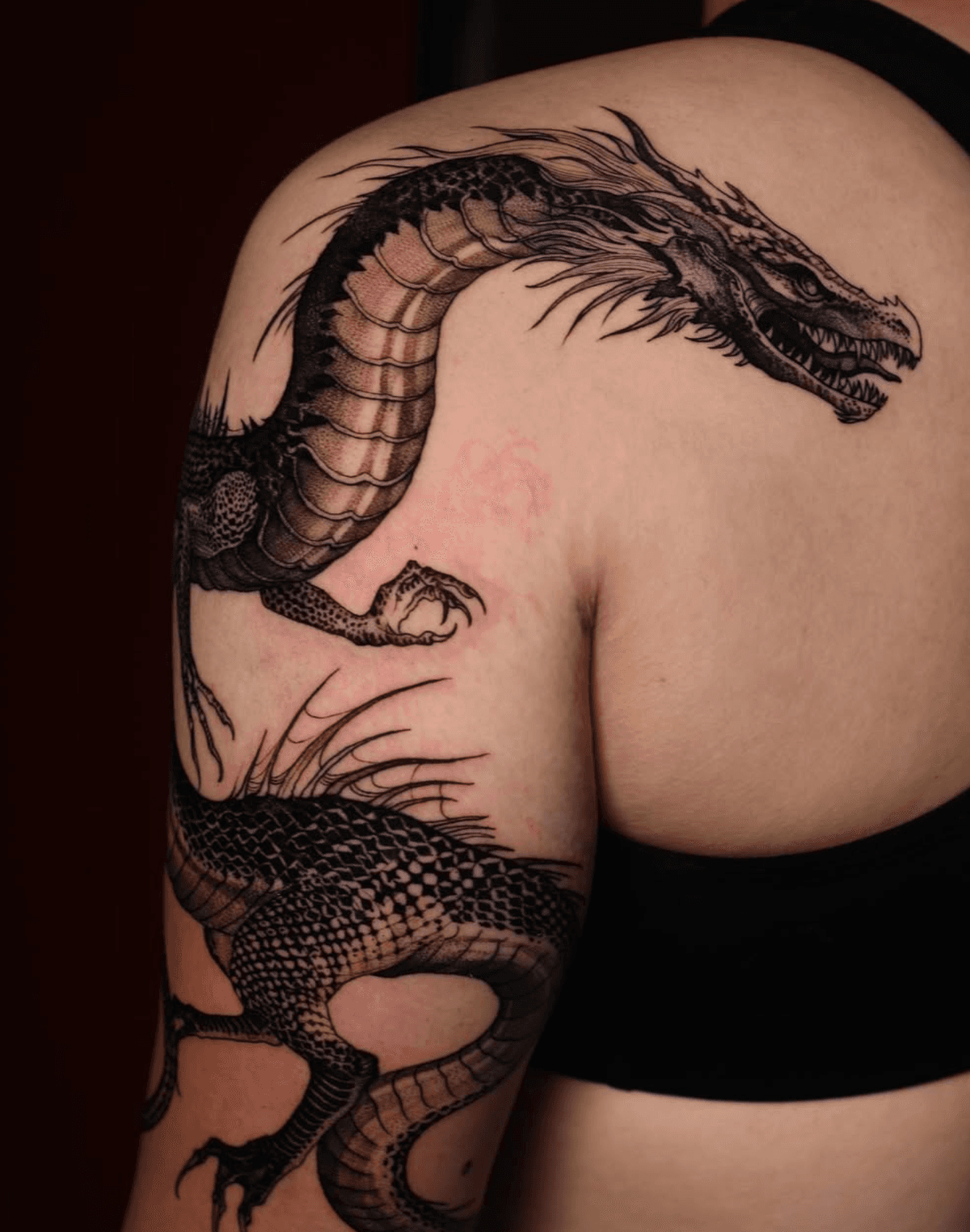 Majestic dragon wrapped around the arm