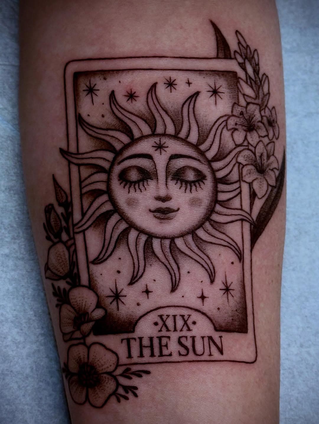 Tarot inspired sun and floral emblem