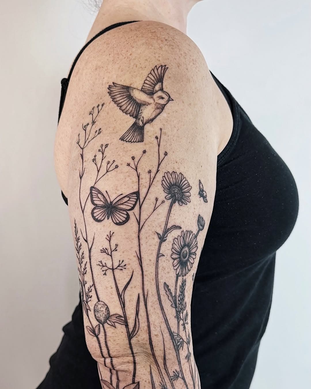 Wildflower and small creature arm piece