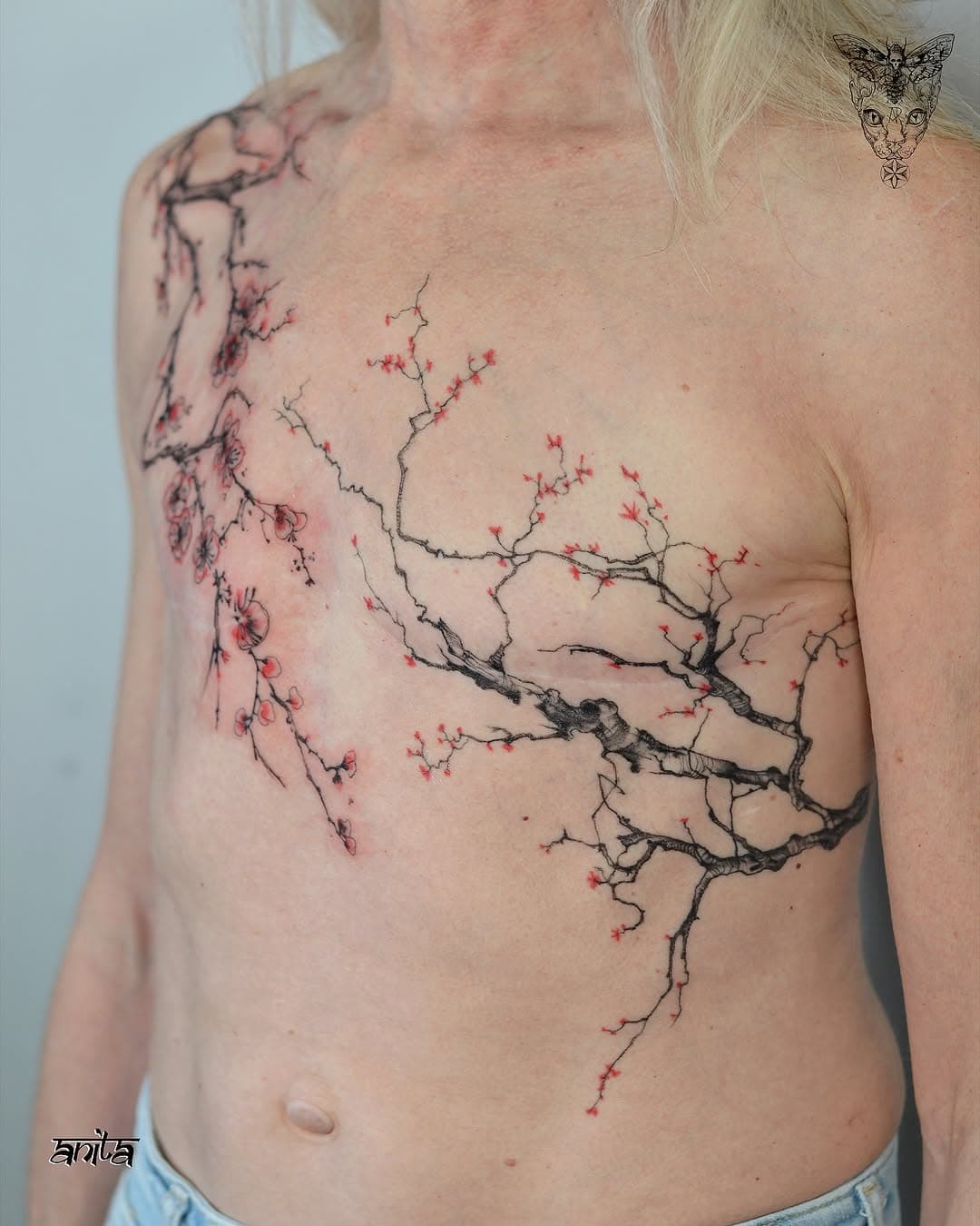Flowering tree branches on torso