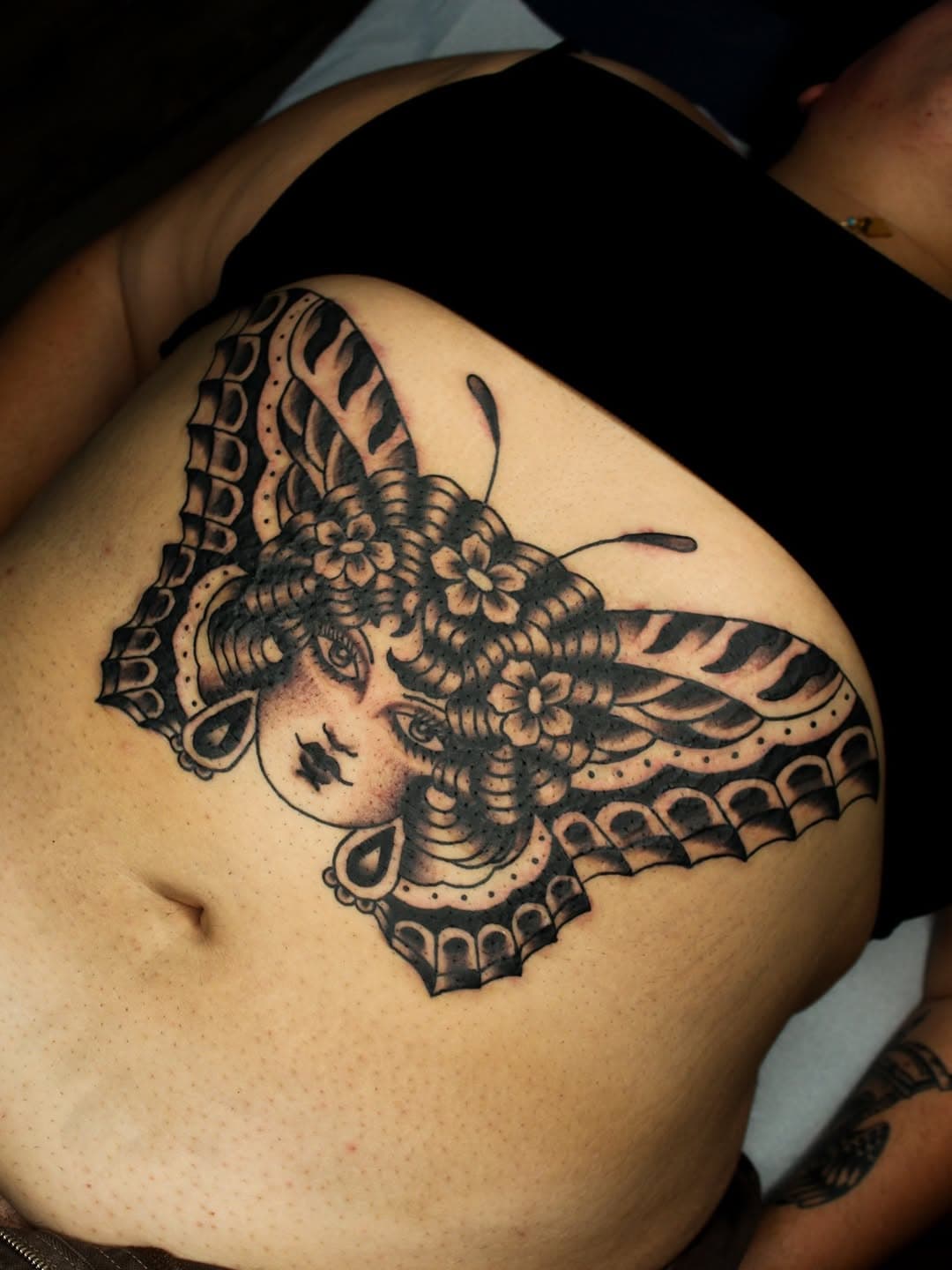 Ornate moth with a woman's face