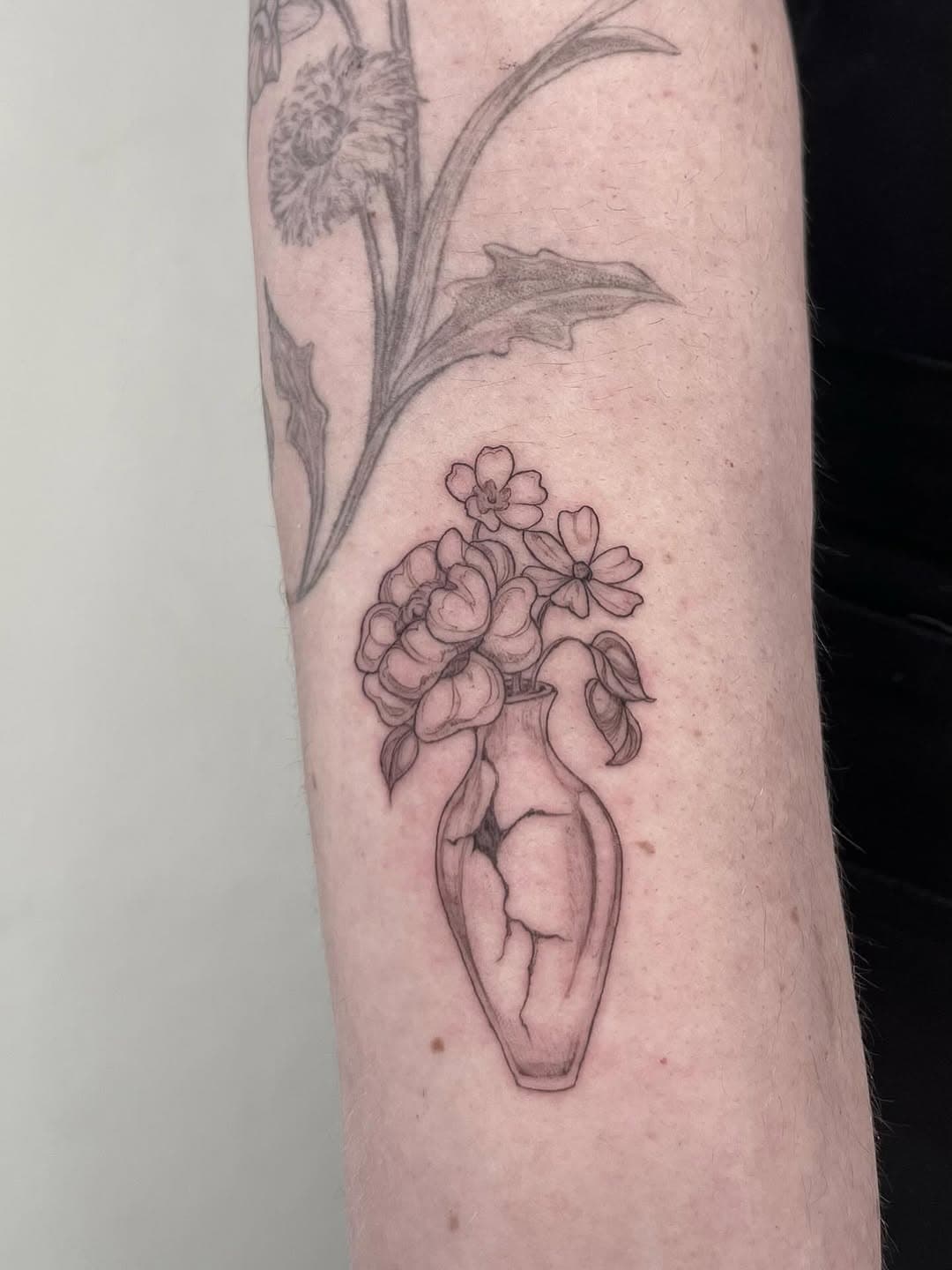 Floral Arrangement in Broken Vase