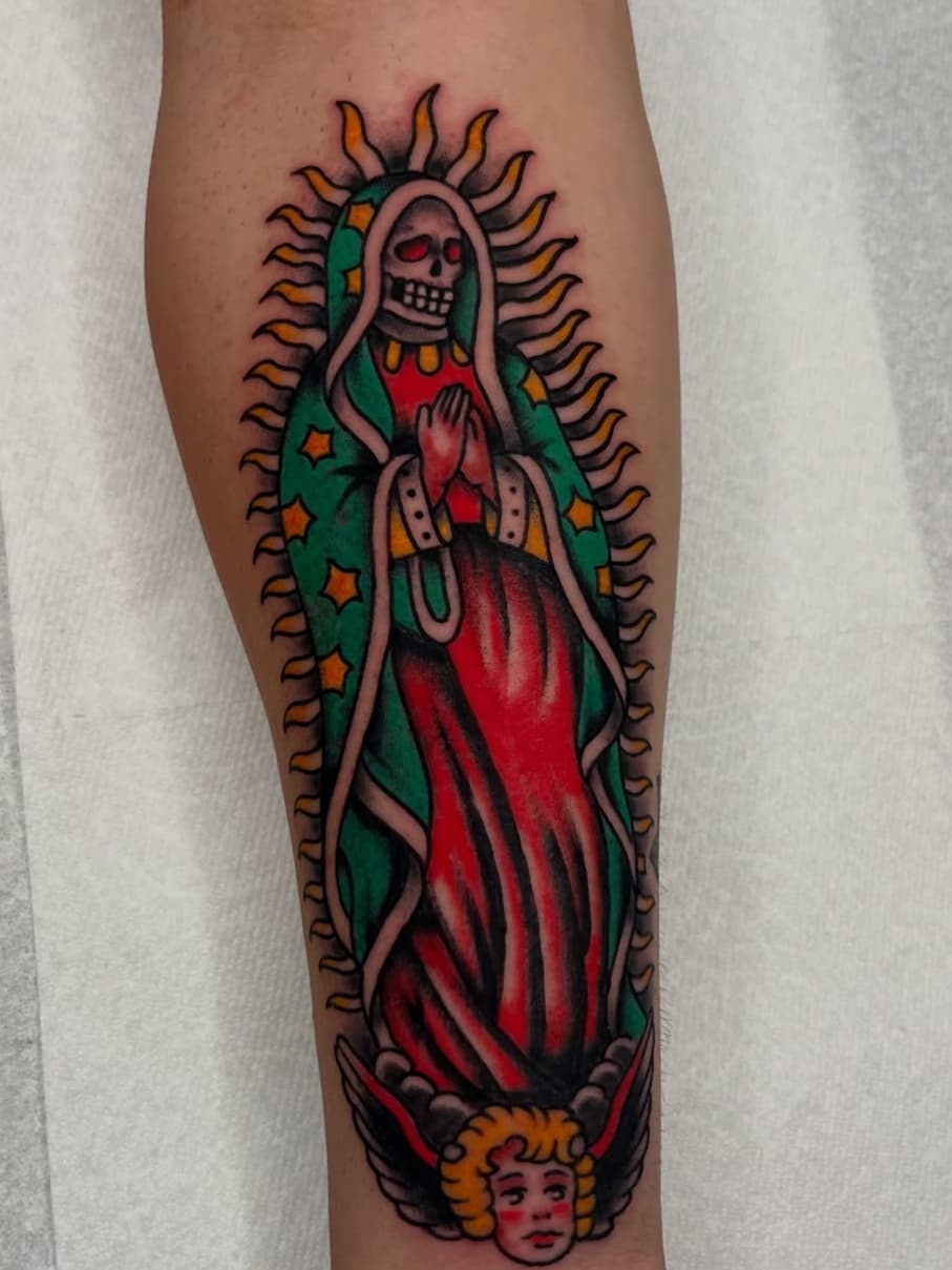 Skeleton Virgin Mary figure with cherub