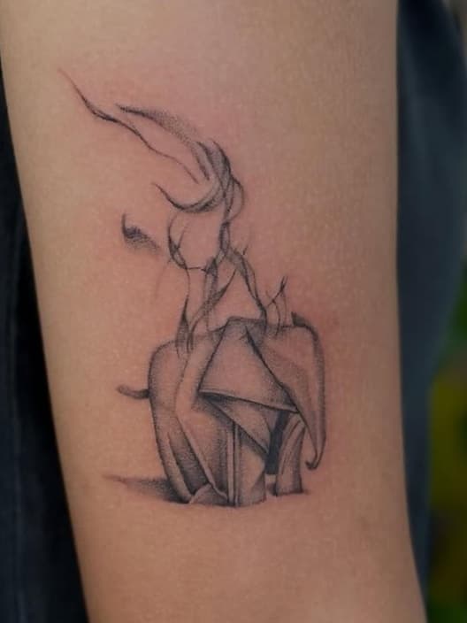 Origami elephant with wispy lines