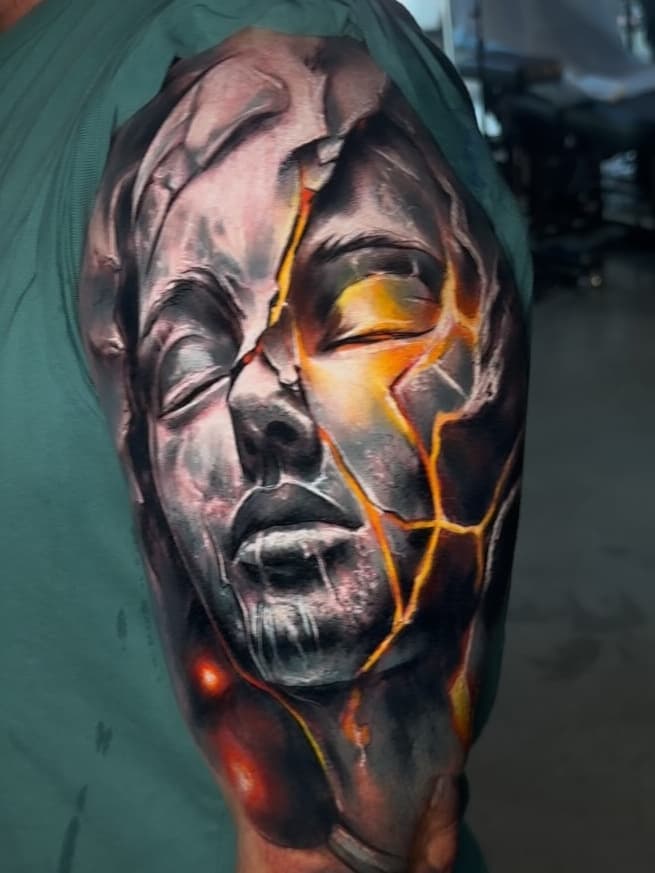 Shattered Stone Face with Fiery Core