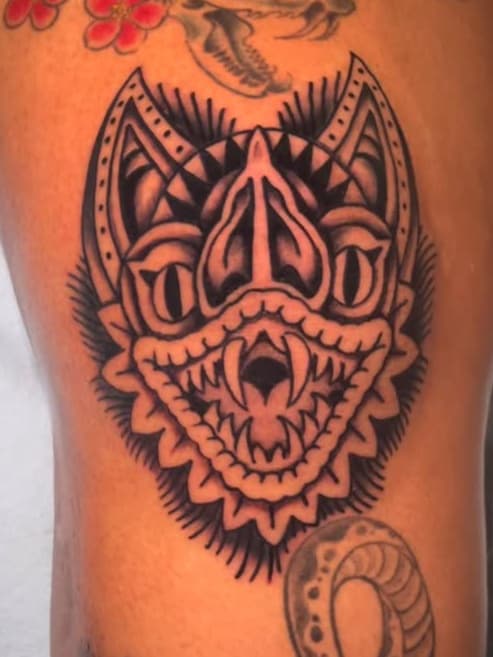 Skeletal snake, bat creature, and coiling serpents