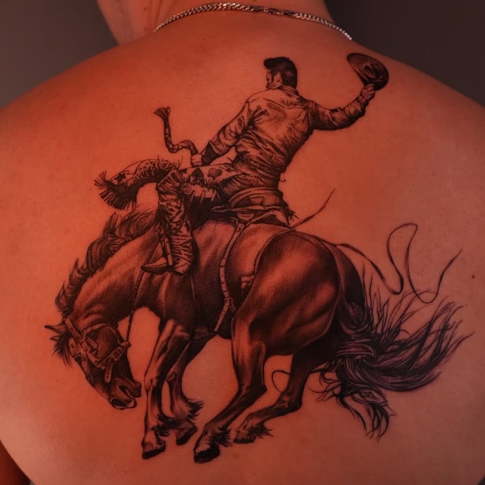 Cowboy on bucking bronco