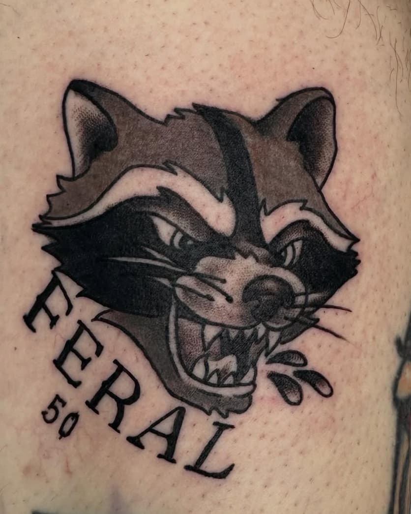 Fierce raccoon head with 'FERAL 50' lettering