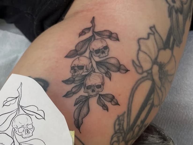 Skull and foliage branch