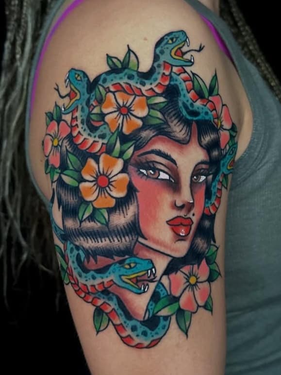 Female head with snakes and flowers