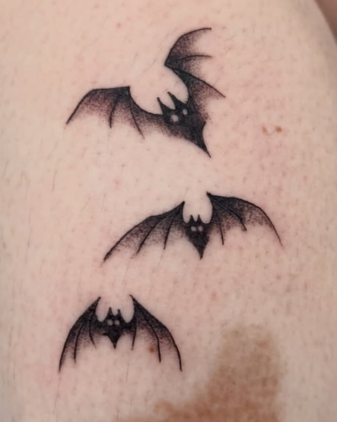 Three flying bats