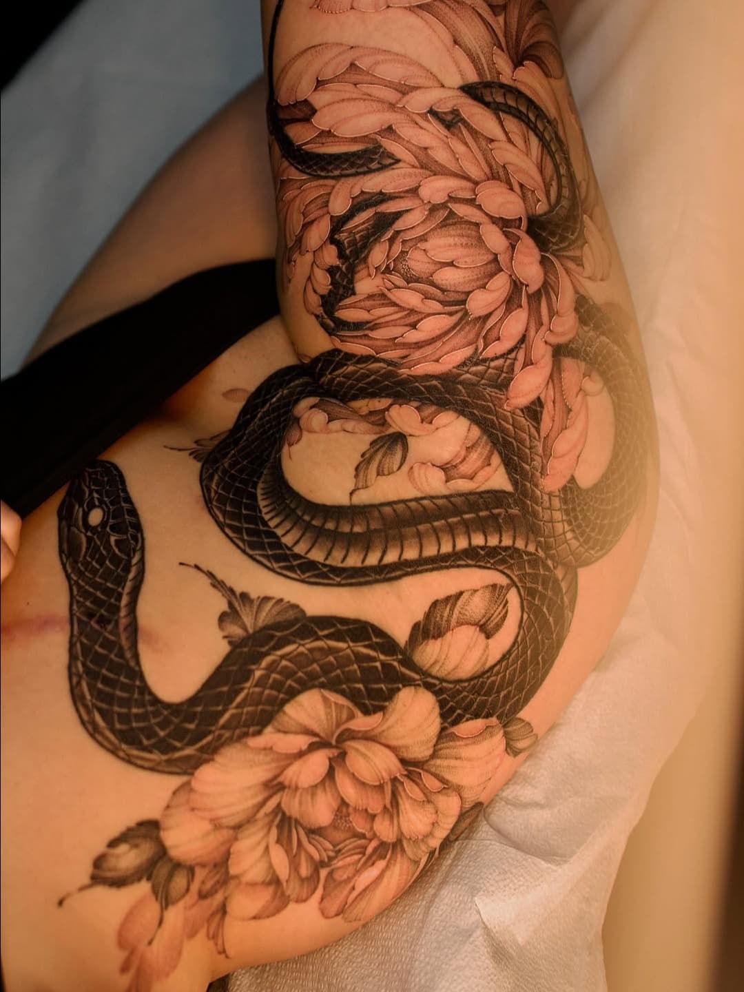 Coiled Serpent with Blossoms