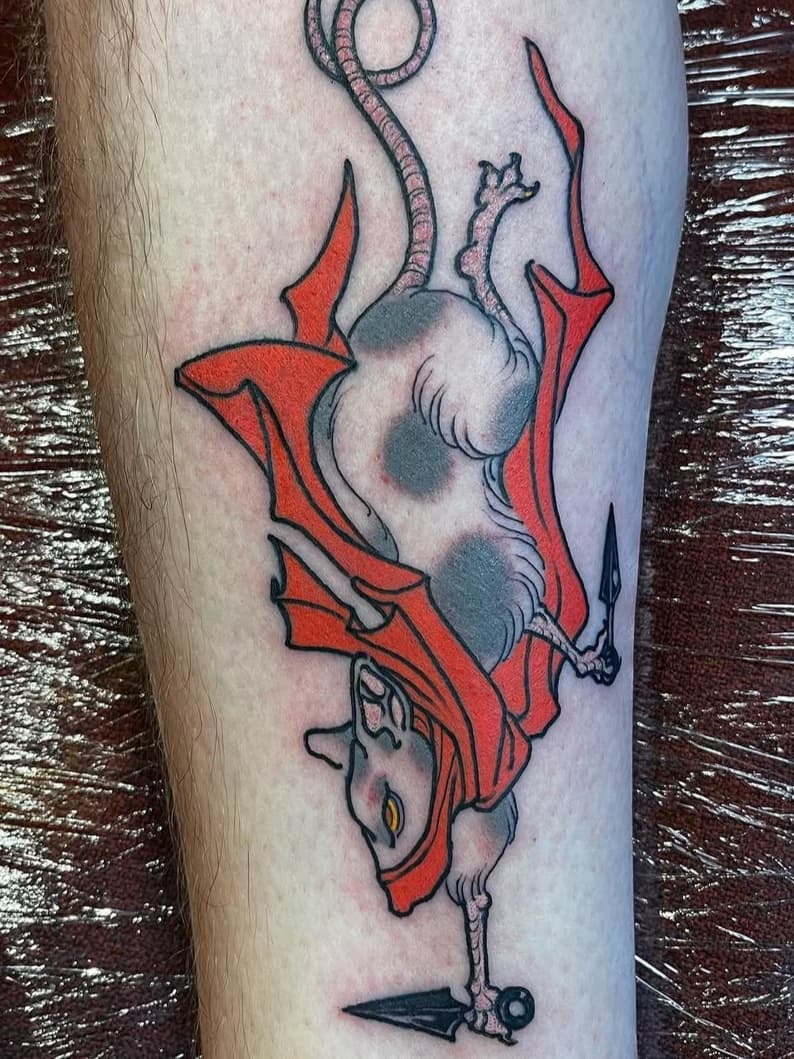 Upside-down rat creature with blade